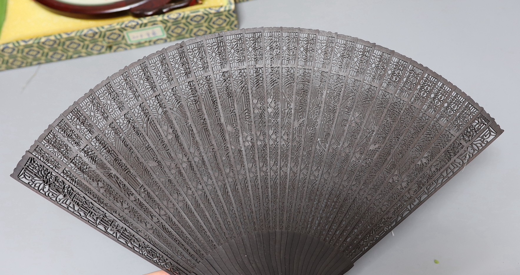 Two Chinese embroidered silk 'cat' table screens and a brise fan set, fan 40 cms wide when open